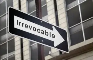 Street sign with Irrevocable written on it.